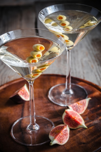 Two olive martini cocktails