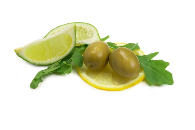 Two olives on a slice of lemon