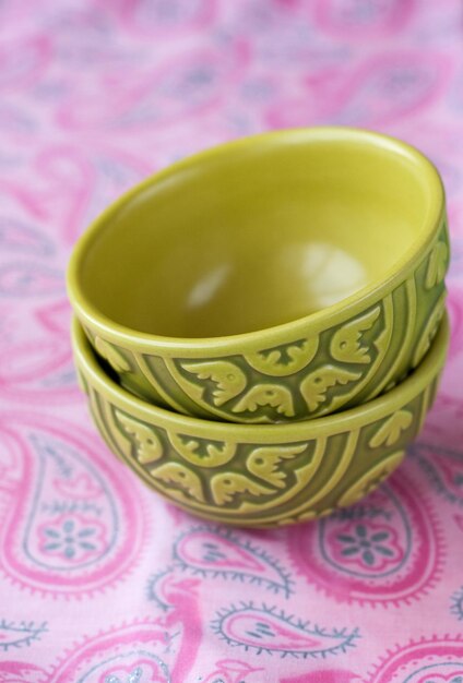 Two oriental national bright bowls on a pink background