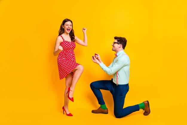 two people geek man propose give ring crazy delighted woman