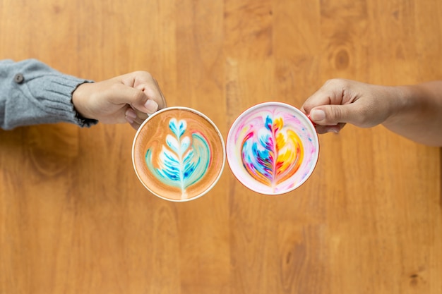 Photo two of people hand holding cup of hot