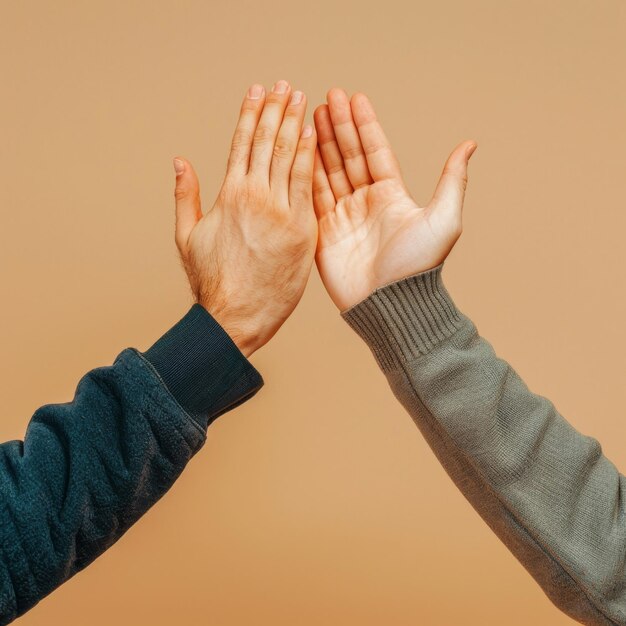 Photo two people holding hands together high five