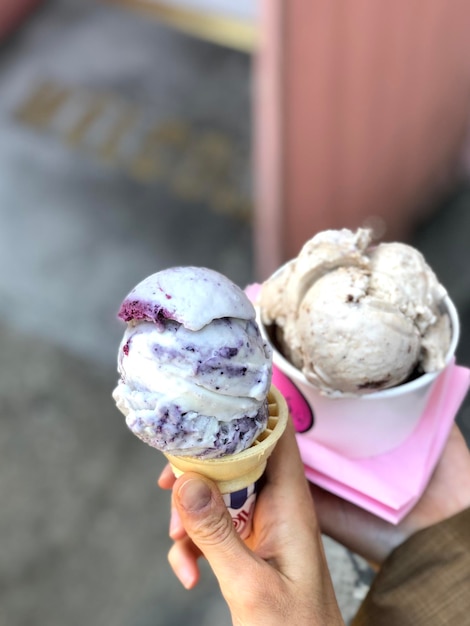 Two people holding ice cream