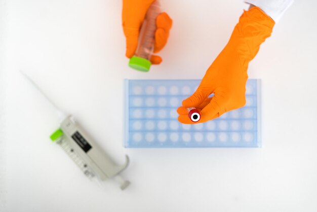 Photo two people holding a syringe next to a syringe