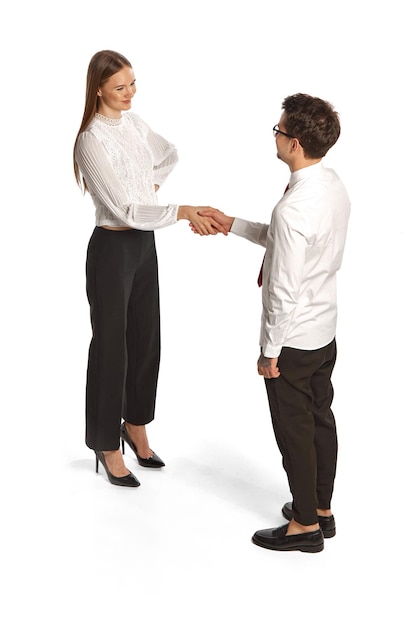 Two people man and woman in business style clothes interact with each other isolated over white
