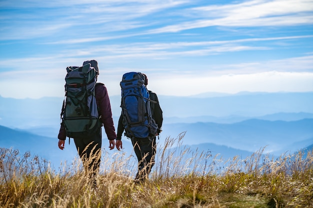 The two people walking on the mountain