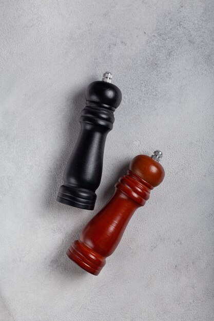 Two peppermill mills on a light background