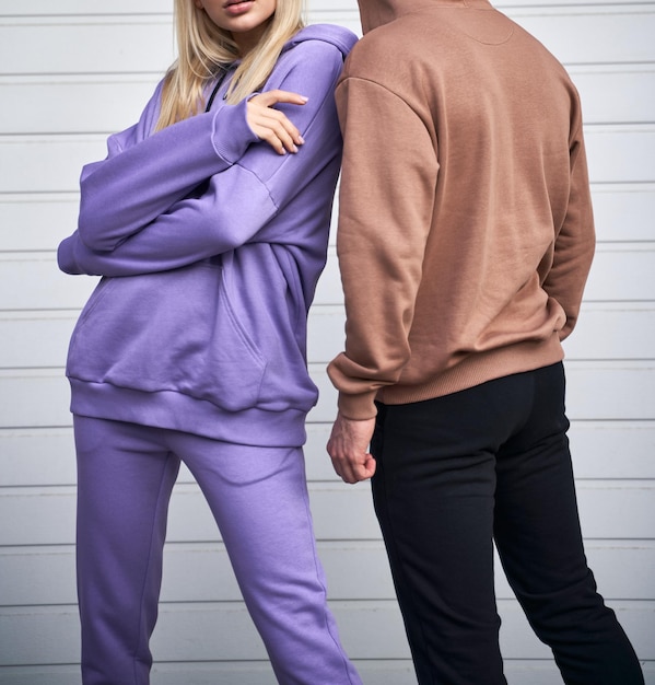Two persons is standing in casual streetwear without logo Design template of sport clothing line