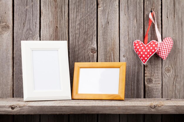 Two photo frames and Valentines day hearts