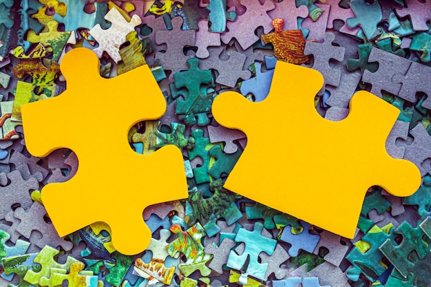 Photo two pieces of jigsaw puzzle. board gamess. business concept.