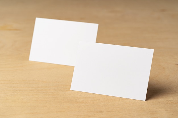 Two piles of blank business cards on table