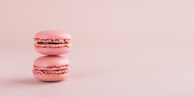 Two pink colored macaroons on pink background Gift for 8 March International Women's Day Valentine Day