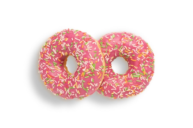 two pink donuts with sprinkles on a white