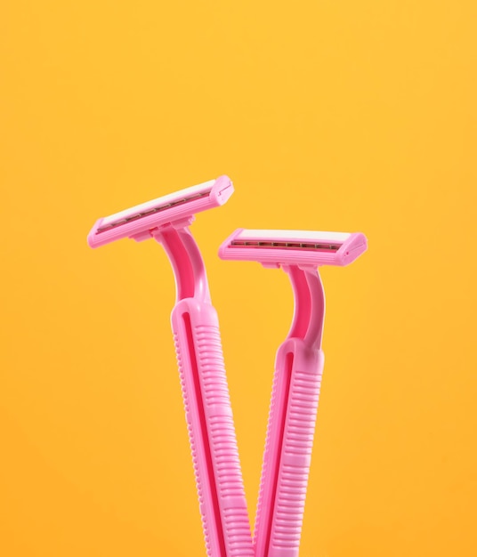 Two pink shaving razors Supplies for body treatment