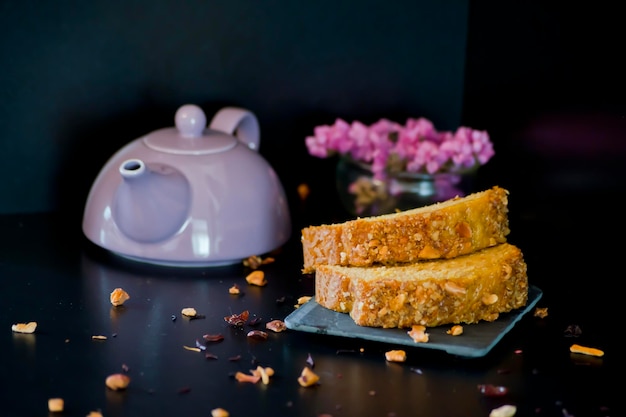 Two portions of cake. Dark background