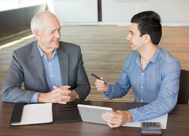 Two Positive Businessmen Discussing New Project