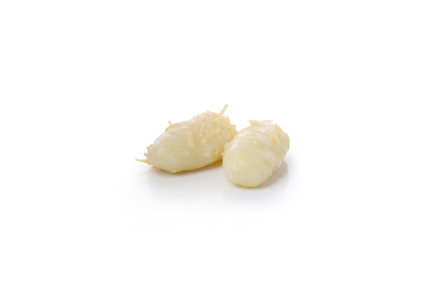 Two potato gnocchi isolated on white background