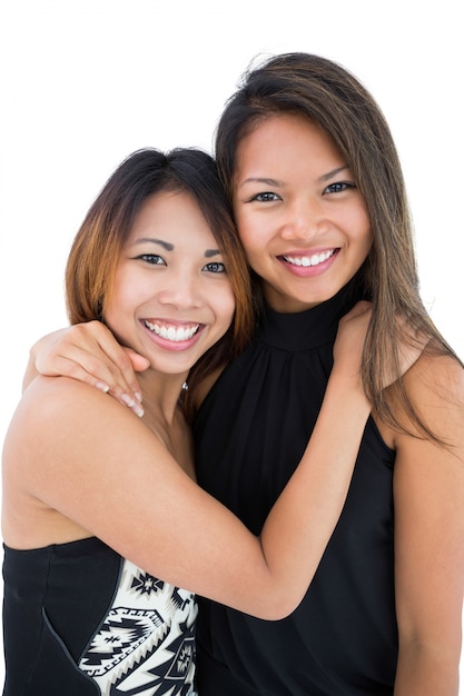 Two pretty young women posing