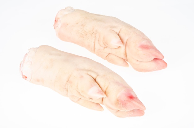 Two raw pork legs for cooking isolated on white background. Studio Photo.