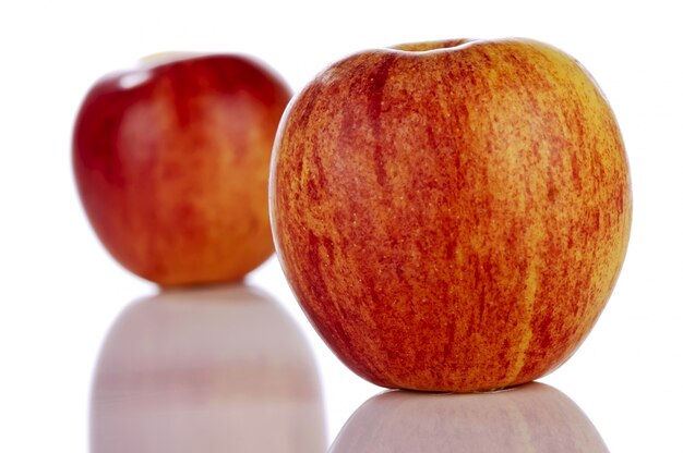 Two red apples isolated on white background