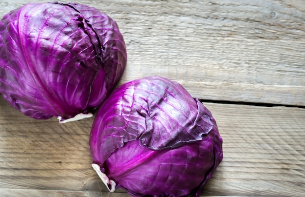 Two red cabbages on wood