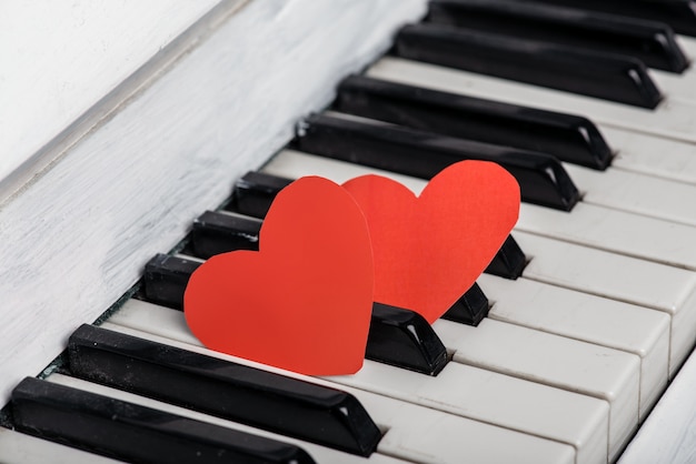 Two red hearts on piano