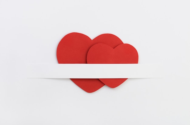 Two red paper Valentine`s hearts