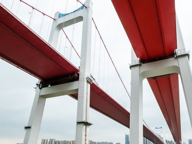 Two red suspension bridges on the Yangtze River in Chongqing, China