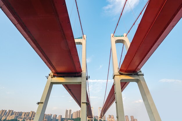 Two red suspension bridges on the Yangtze River in Chongqing, China