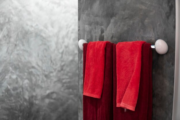 Photo two red towels in bathroom on a dryer counter bathroom interior contemporary