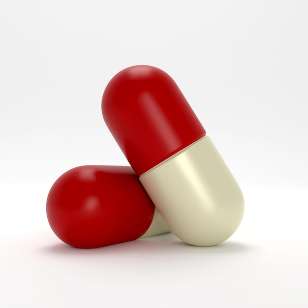 Two red and white pills are stacked together on a white background