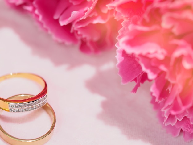 two rings with pink flower for wedding