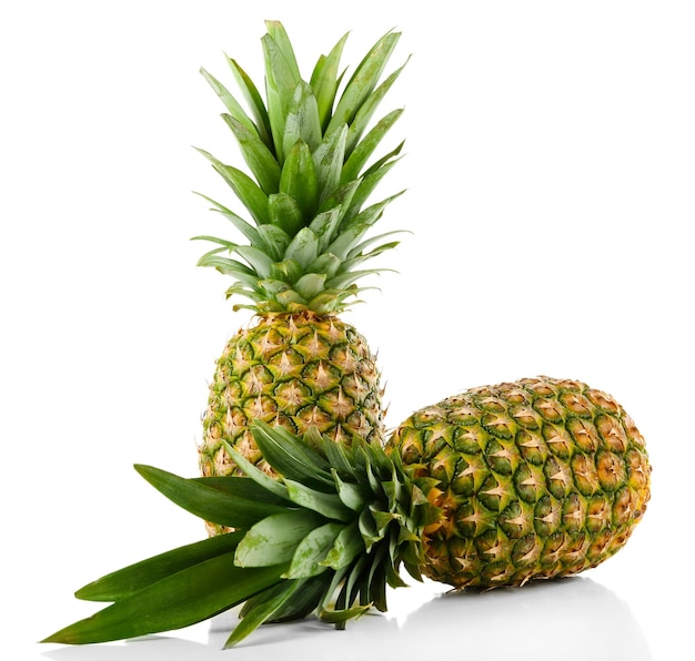 Two ripe fresh pineapples isolated on white