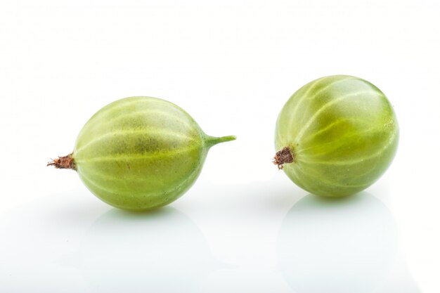 Two ripe green gooseberries isolated on white background 