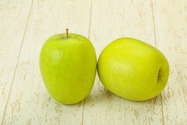 Two ripe green sweet apples