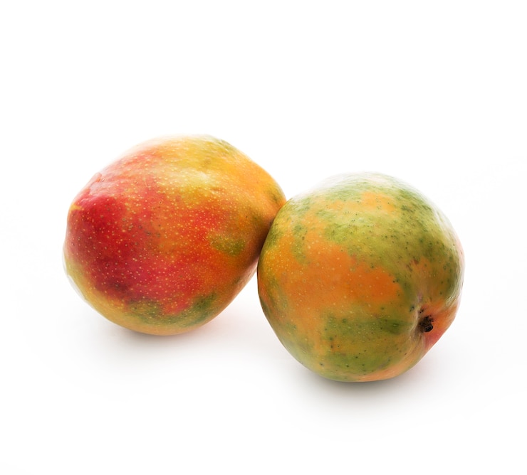 Photo two ripe israeli mangoes isolated, close-up