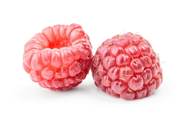 Two ripe raspberries isolated on white close up