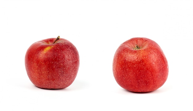 Two ripe red round apples