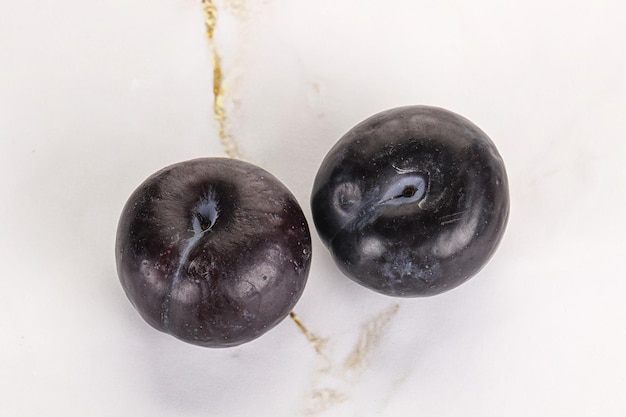 Photo two ripe sweet black plums