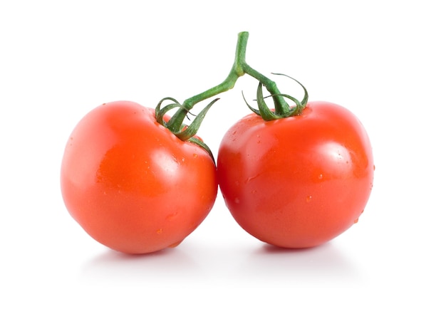 Два спелых помидора на белом фоне