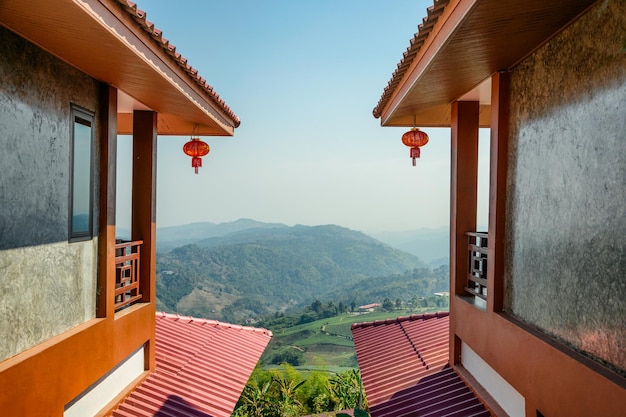 Two room of resort chinese tribe design with view tea plantation on hill and blue sky