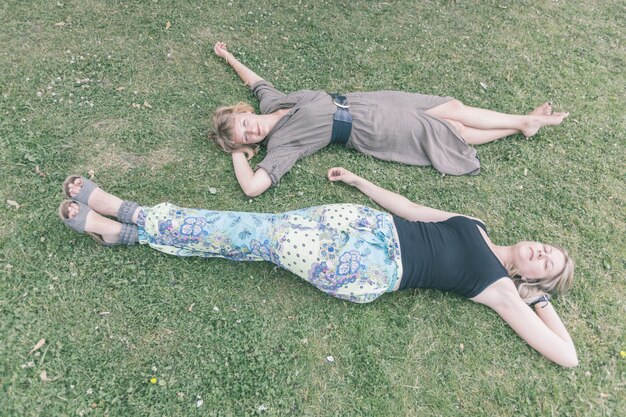 Two Russian Girls Lying on the Lawn