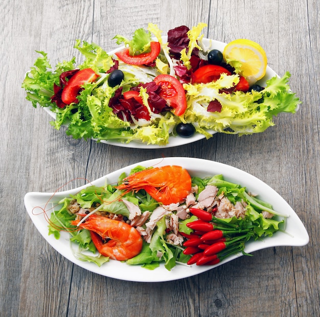 Two salad on wooden table