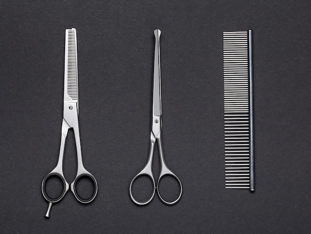 Two scissors and a metal comb