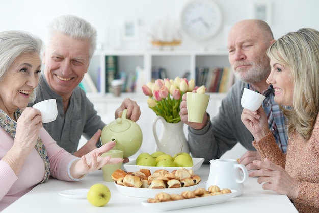 Two Senior couples drinking tea