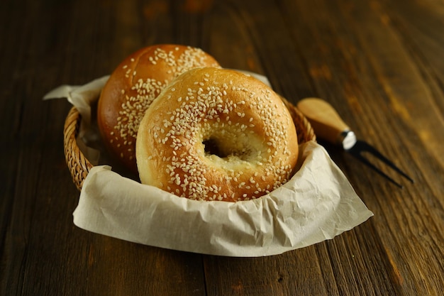 Two sesame bagels on the rattan basket