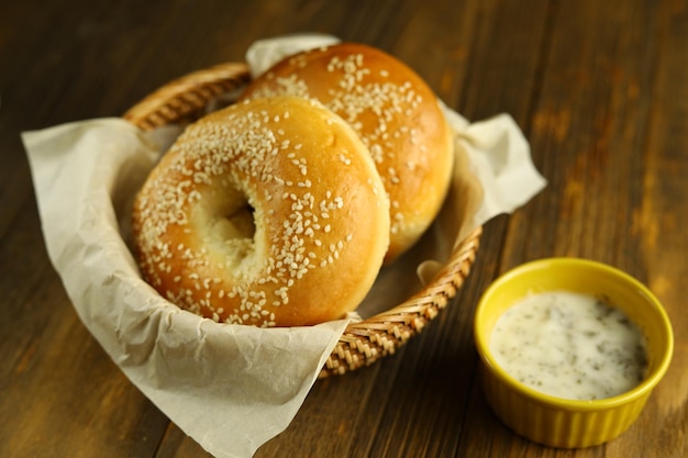 Two sesame bagels on the rattan basket