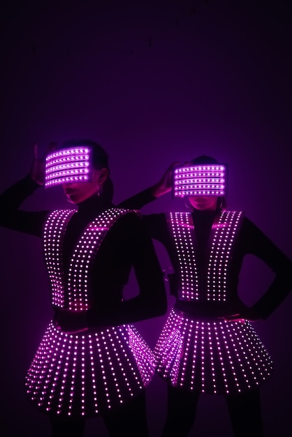 Two sexy disco dancers move in UV costumes