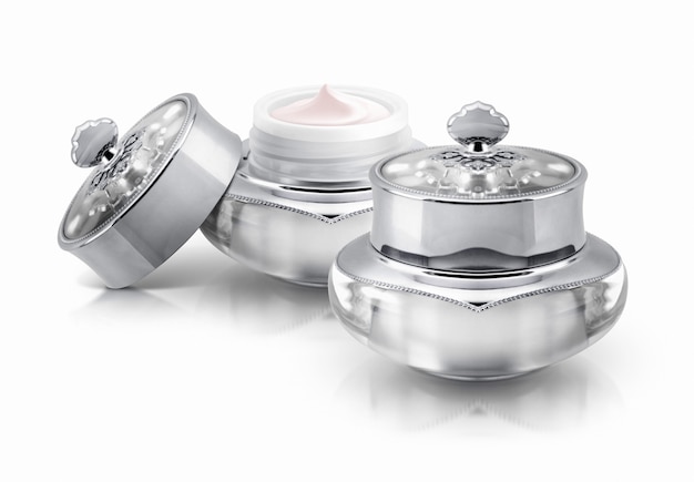 Two silver deluxe cosmetic jars