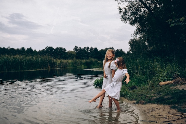 Two sisters having fun in nature